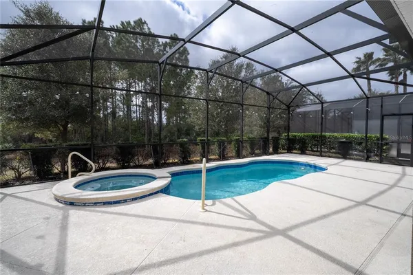 a view of a swimming pool with a patio