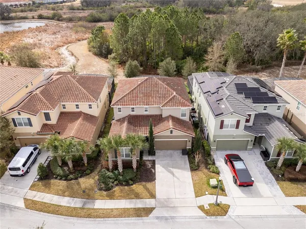 a large kitchen with sink stainless steel appliances and cabinets