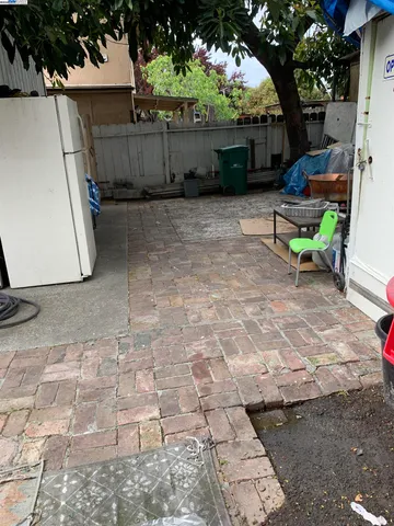 a view of backyard with outdoor seating and green space