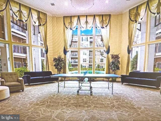 501 Hungerford Drive, Unit 445 Rockville, MD 20850 - Photo 13 of 18 Recreation room leads to outdoor pool