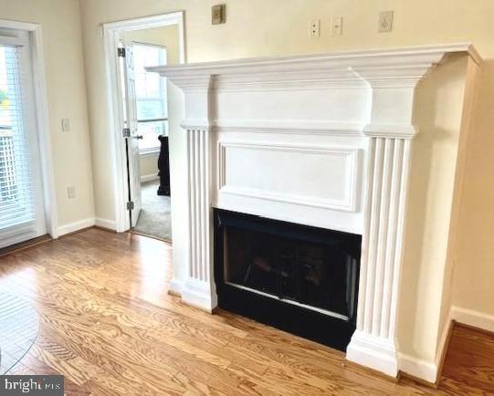 501 Hungerford Drive, Unit 445 Rockville, MD 20850 - Photo 4 of 18 Stately fireplace w/ mantel in center of the room