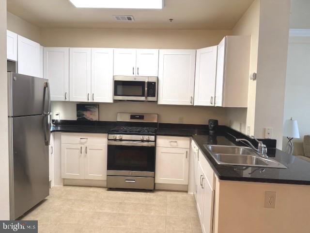 501 Hungerford Drive, Unit 445 Rockville, MD 20850 - Photo 6 of 18 Well-equipped SS kitchen