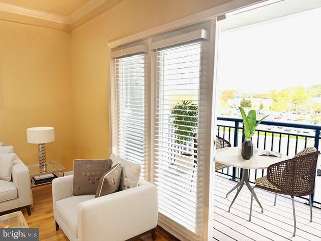501 Hungerford Drive, Unit 445 Rockville, MD 20850 - Photo 7 of 18 Living room flows to balcony