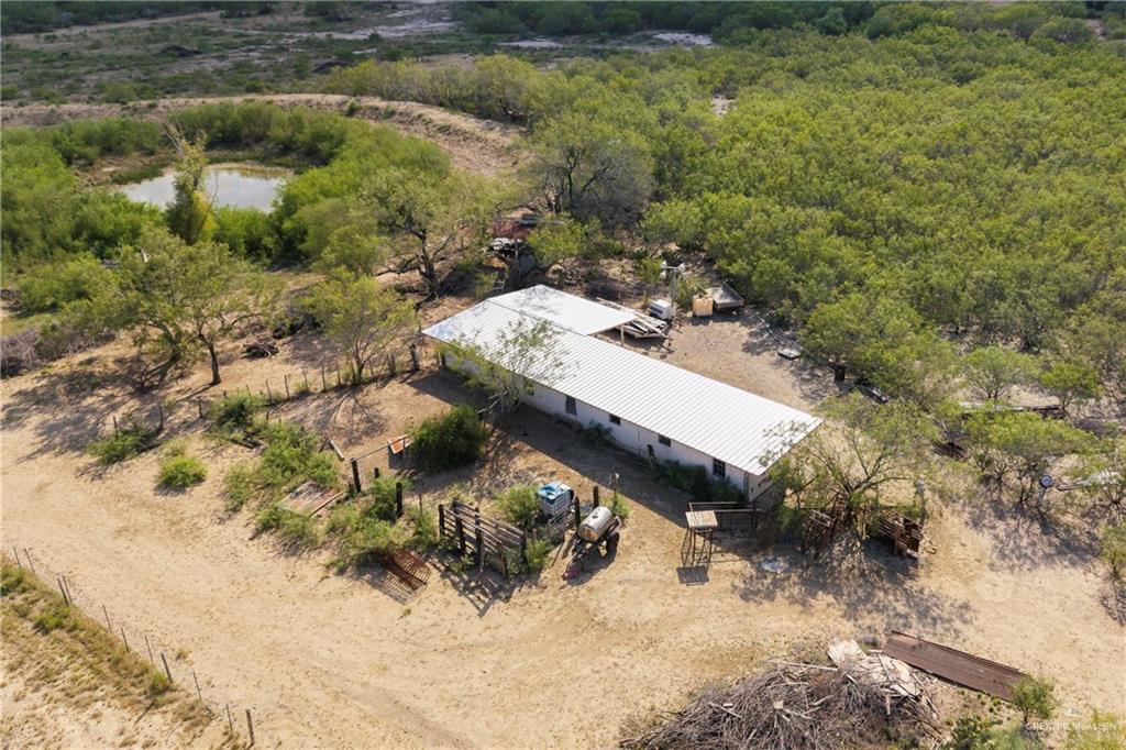 17-18 North Julian Road Roma, TX 78584 - Photo 3 of 17 a view of a house with a yard covered with snow in the background