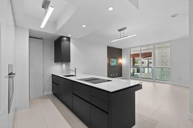 a room with a sink furniture and a mirror