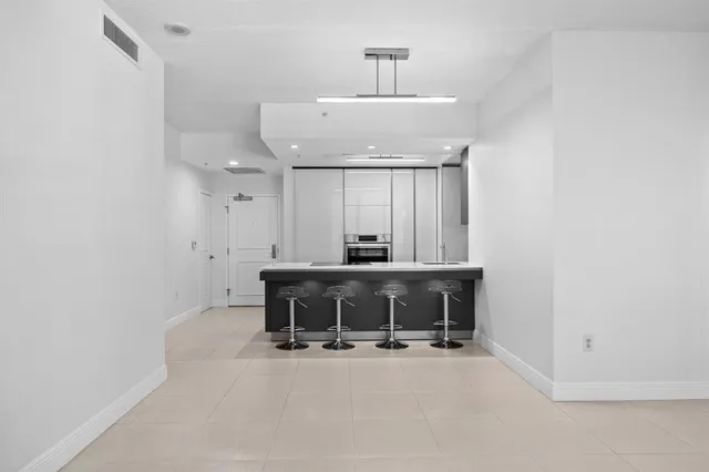 a view of a room with furniture and a window