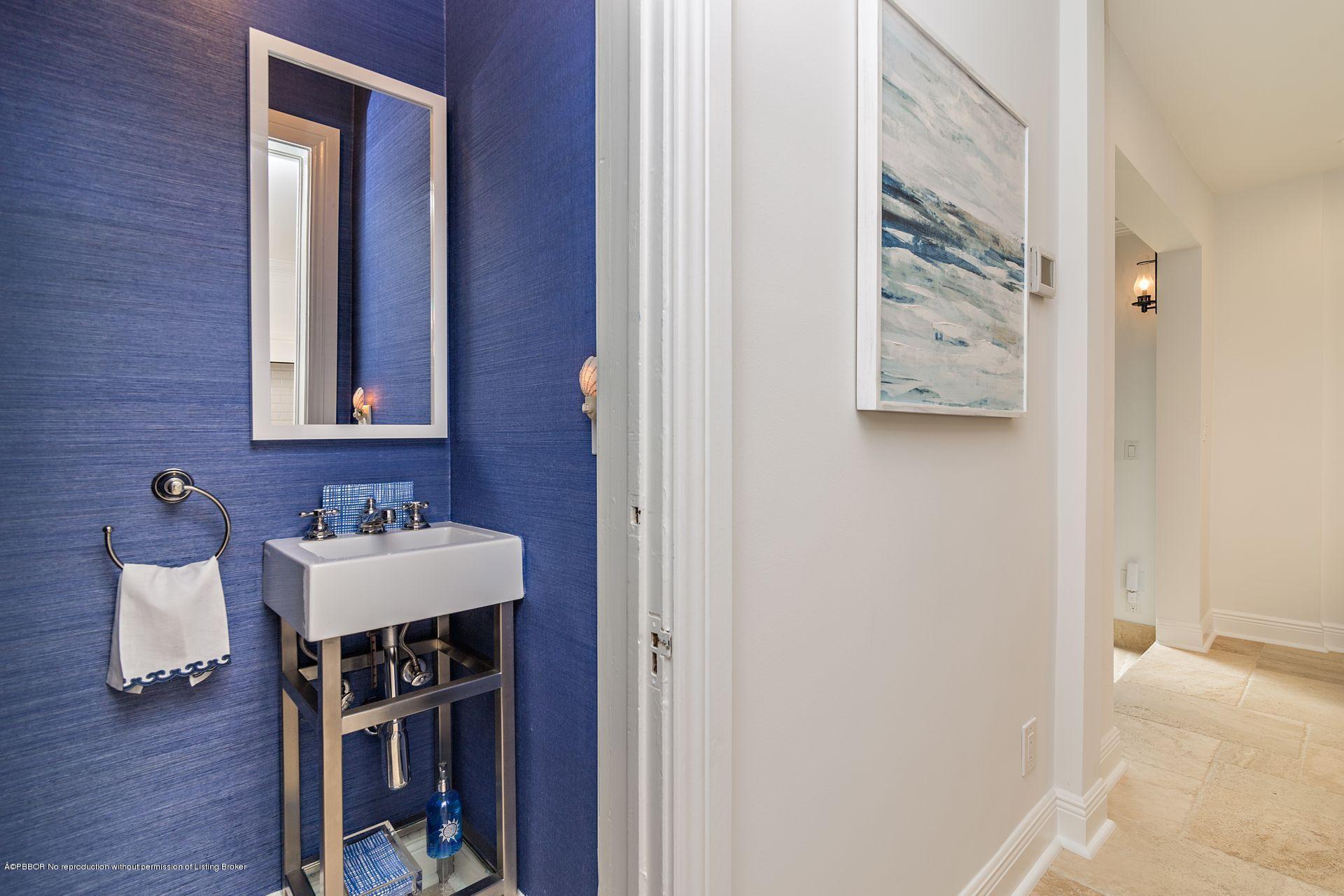 194 Pershing Way West Palm Beach, FL 33401 - Photo 19 of 50 a bathroom with a sink and a mirror