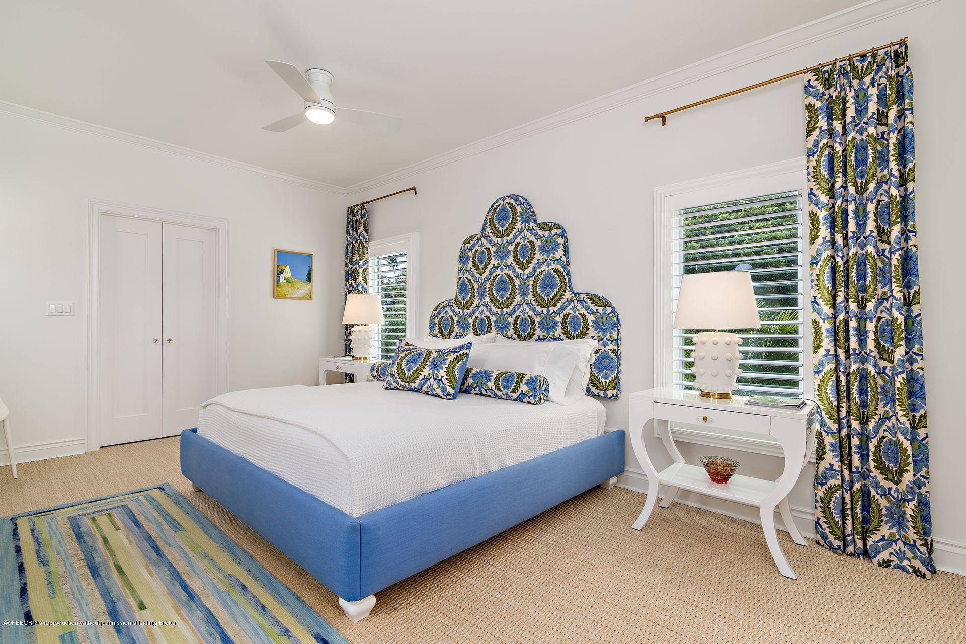 194 Pershing Way West Palm Beach, FL 33401 - Photo 20 of 50 a bedroom with a bed and a chair