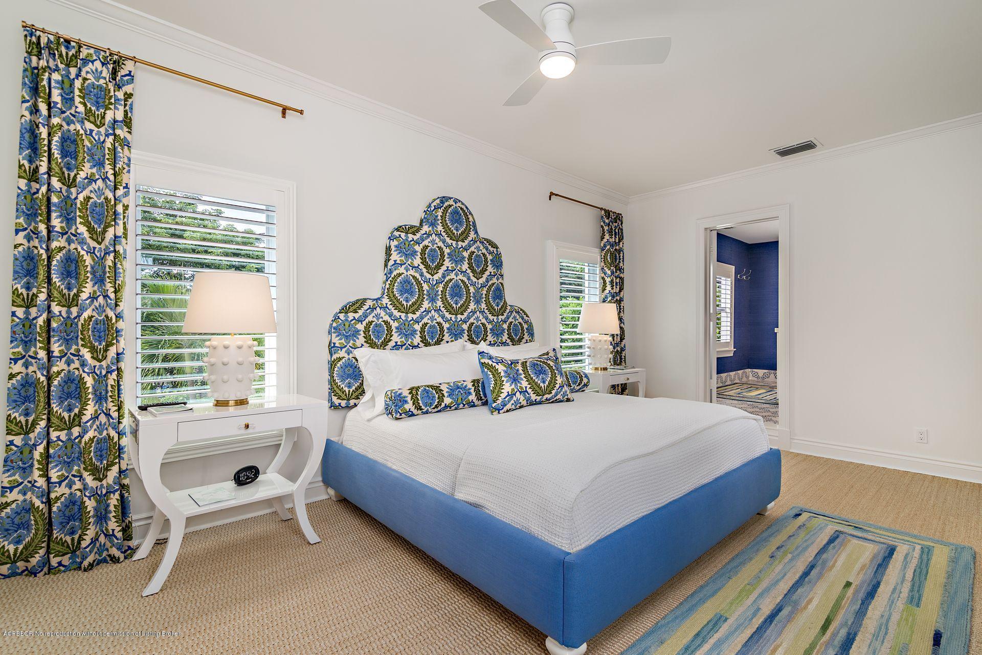 194 Pershing Way West Palm Beach, FL 33401 - Photo 21 of 50 a bedroom with a bed and a chandelier