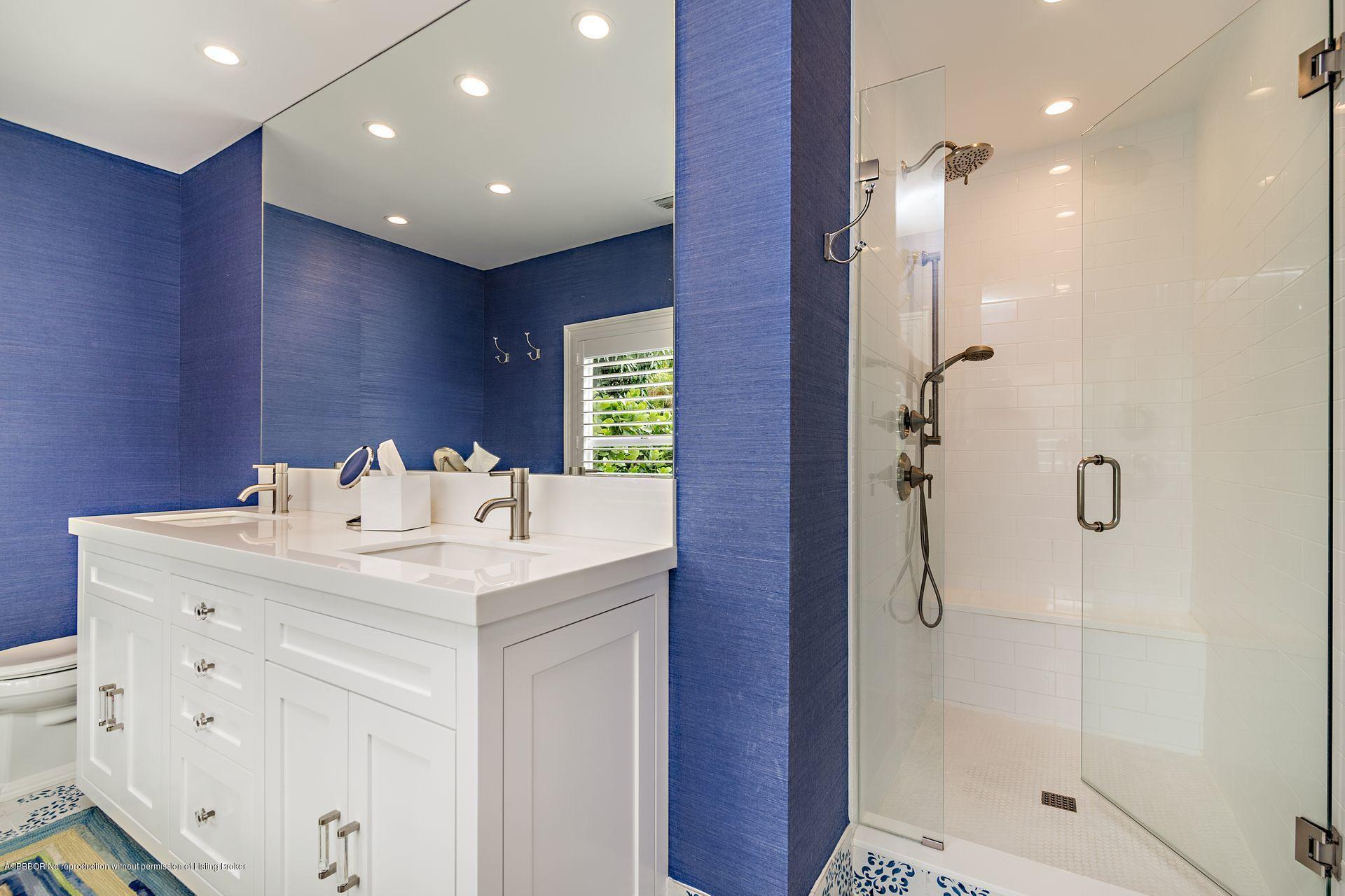 194 Pershing Way West Palm Beach, FL 33401 - Photo 23 of 50 a bathroom with a sink shower and a mirror