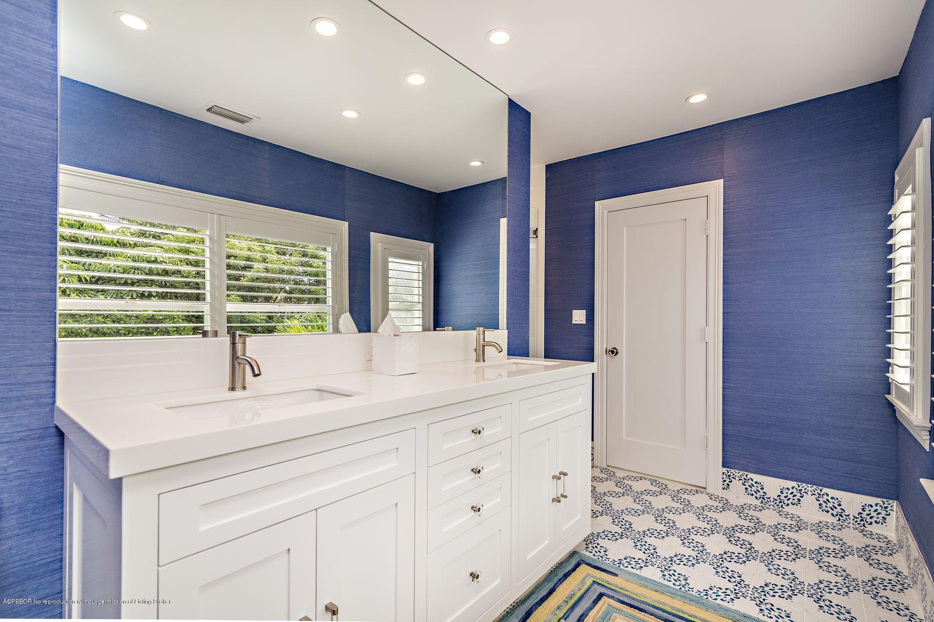 194 Pershing Way West Palm Beach, FL 33401 - Photo 24 of 50 a bathroom with a sink and a mirror
