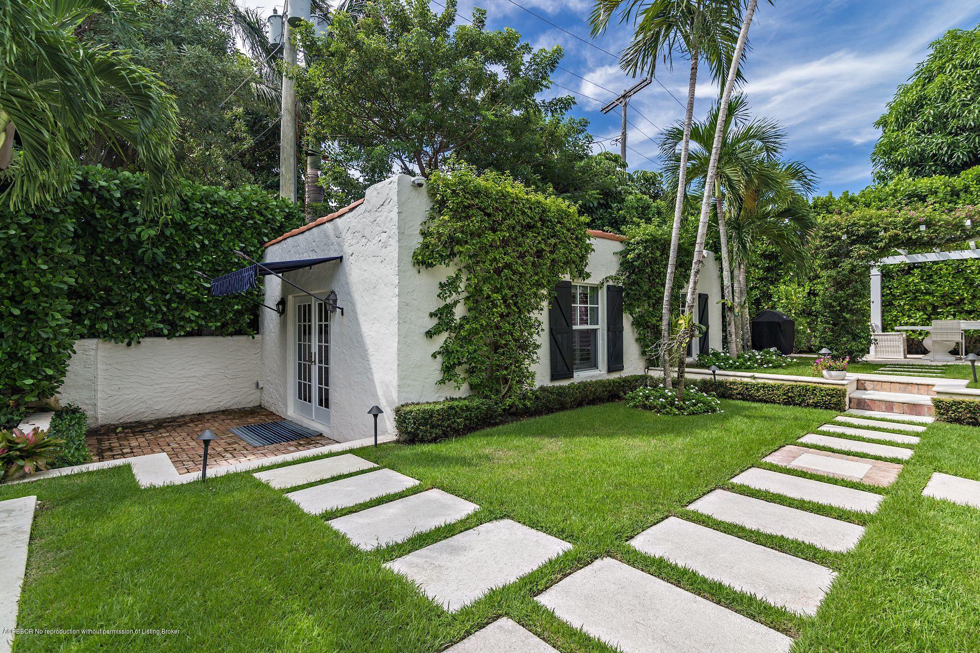 194 Pershing Way West Palm Beach, FL 33401 - Photo 26 of 50 a front view of a house with garden