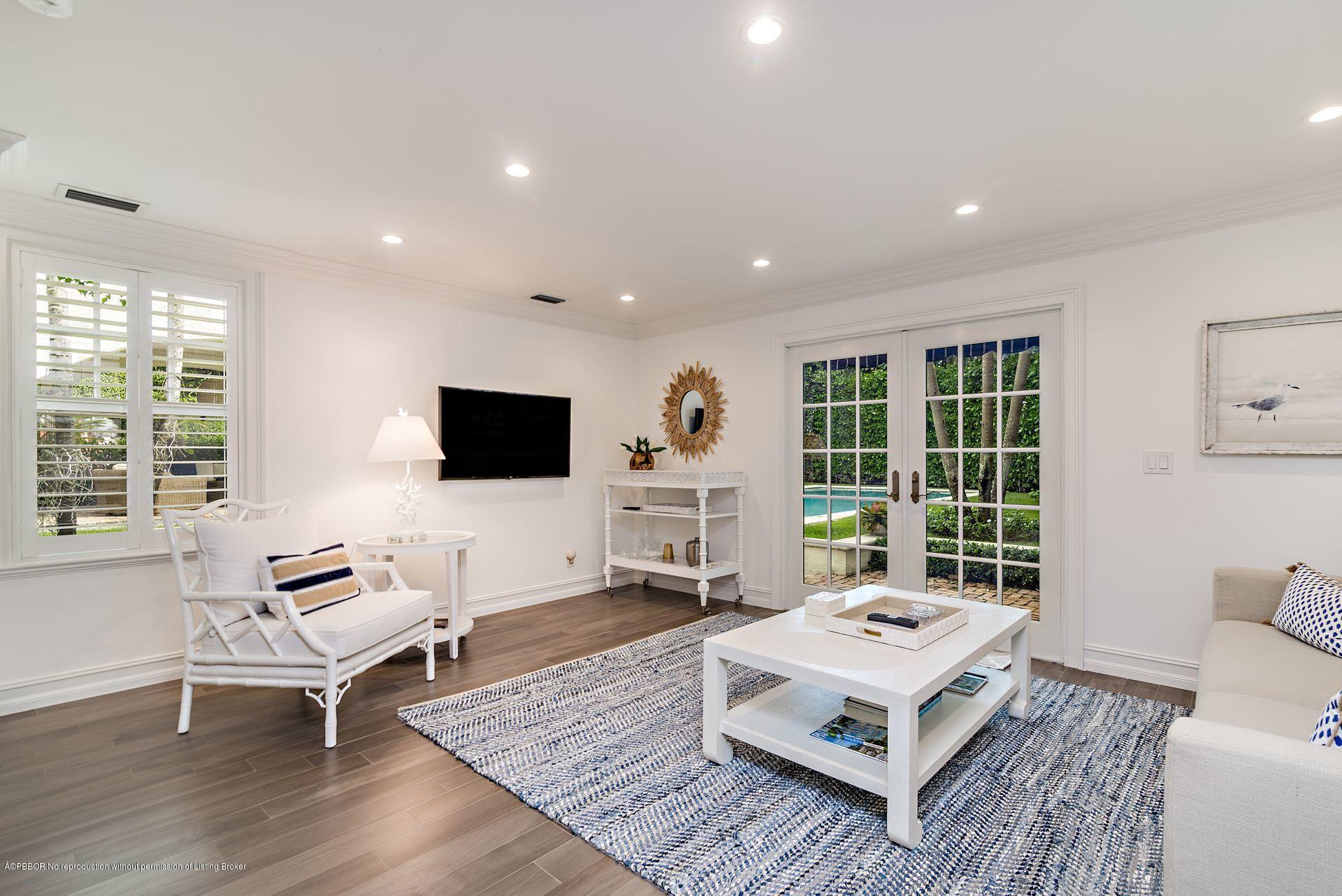 194 Pershing Way West Palm Beach, FL 33401 - Photo 27 of 50 a living room with furniture rug and a large window