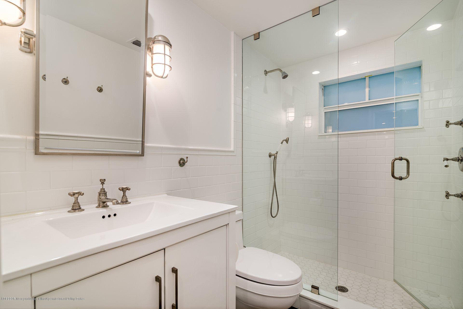 194 Pershing Way West Palm Beach, FL 33401 - Photo 30 of 50 a bathroom with a sink a toilet and shower