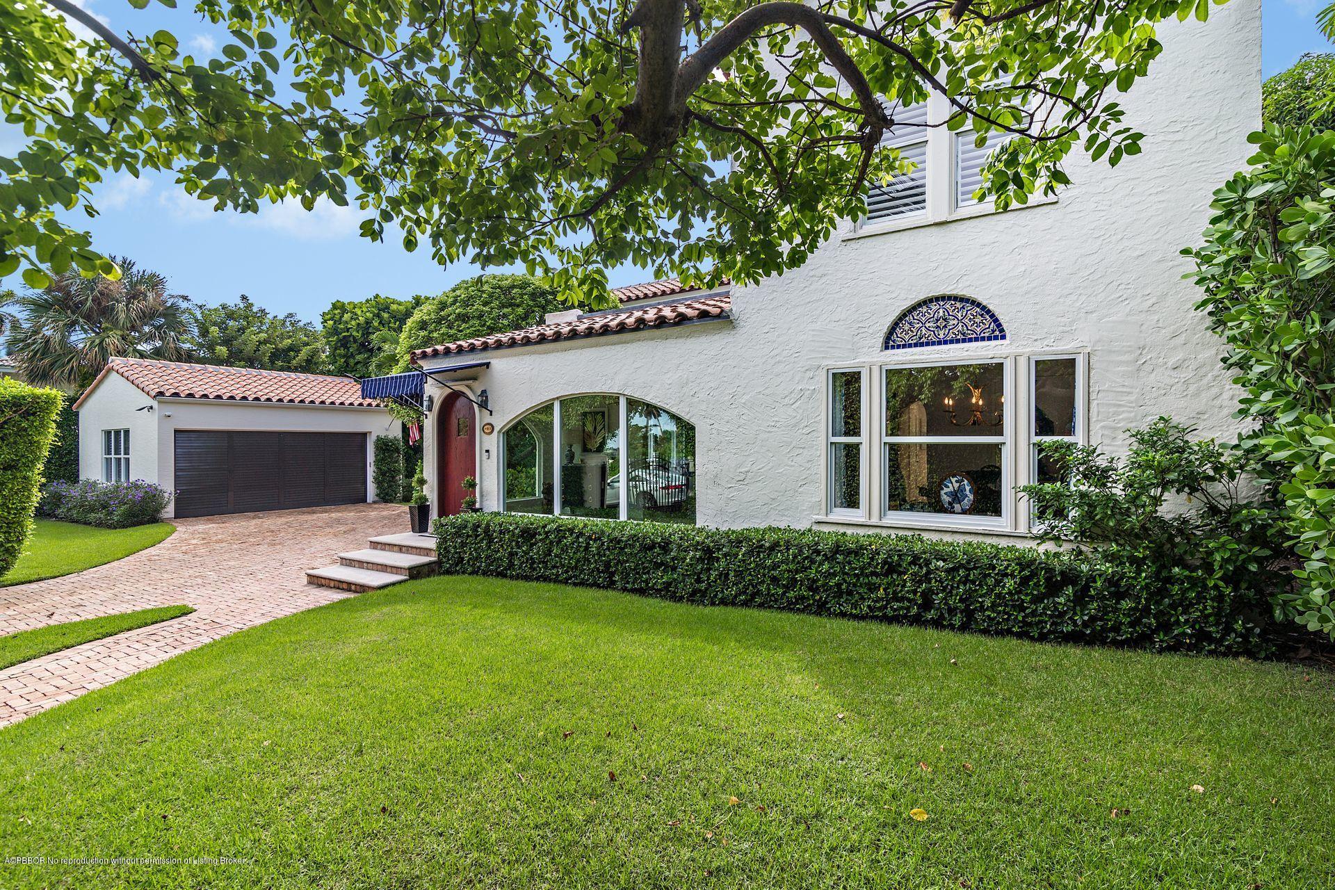 194 Pershing Way West Palm Beach, FL 33401 - Photo 34 of 50 a front view of a house with a garden and yard
