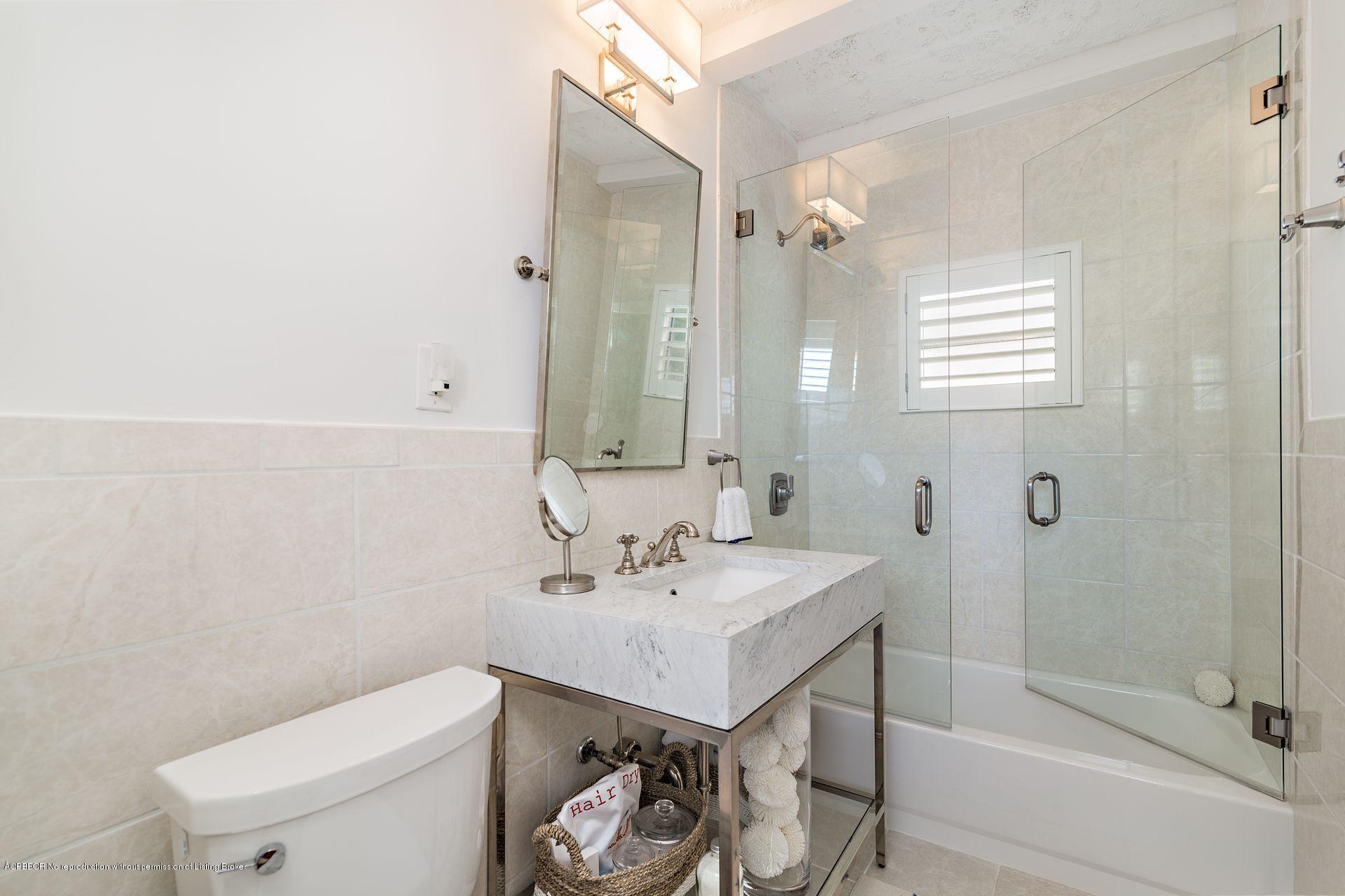 194 Pershing Way West Palm Beach, FL 33401 - Photo 45 of 50 a bathroom with a sink a toilet and shower