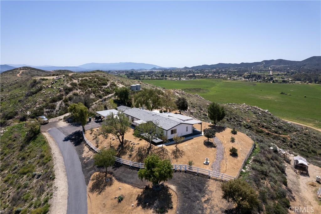 26955 Garbani Road Menifee, CA 92584 - Photo 1 of 1 an aerial view of a house with a lake view