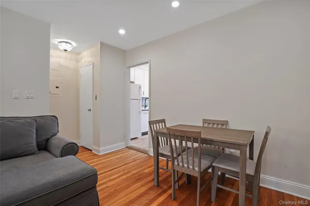 a view of a livingroom with furniture and wooden floor