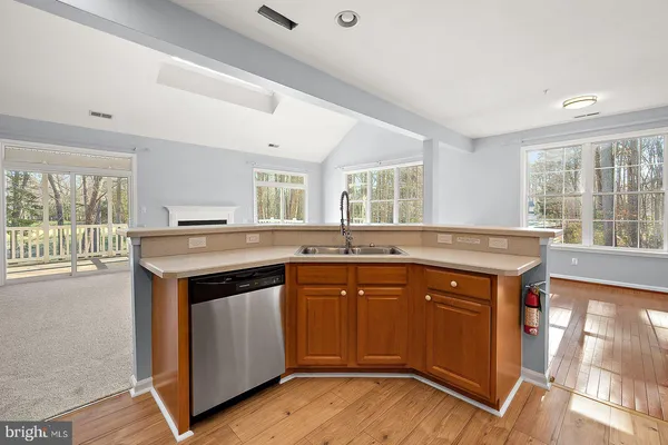 a view of livingroom with hardwood floor and hallway