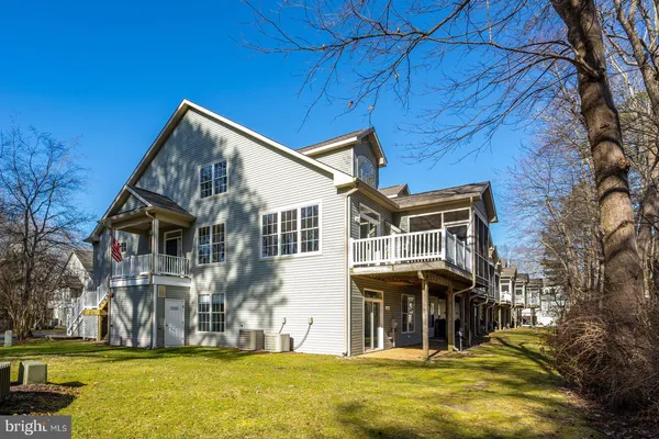 a view of a house with pool and a yard