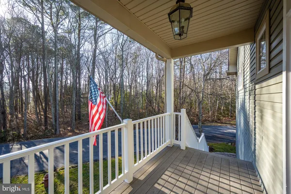 a view of a livingroom with wooden floor and a fireplace