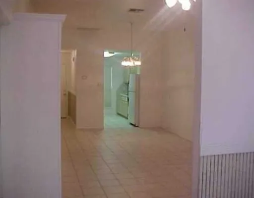 a view of a chandelier in hallway