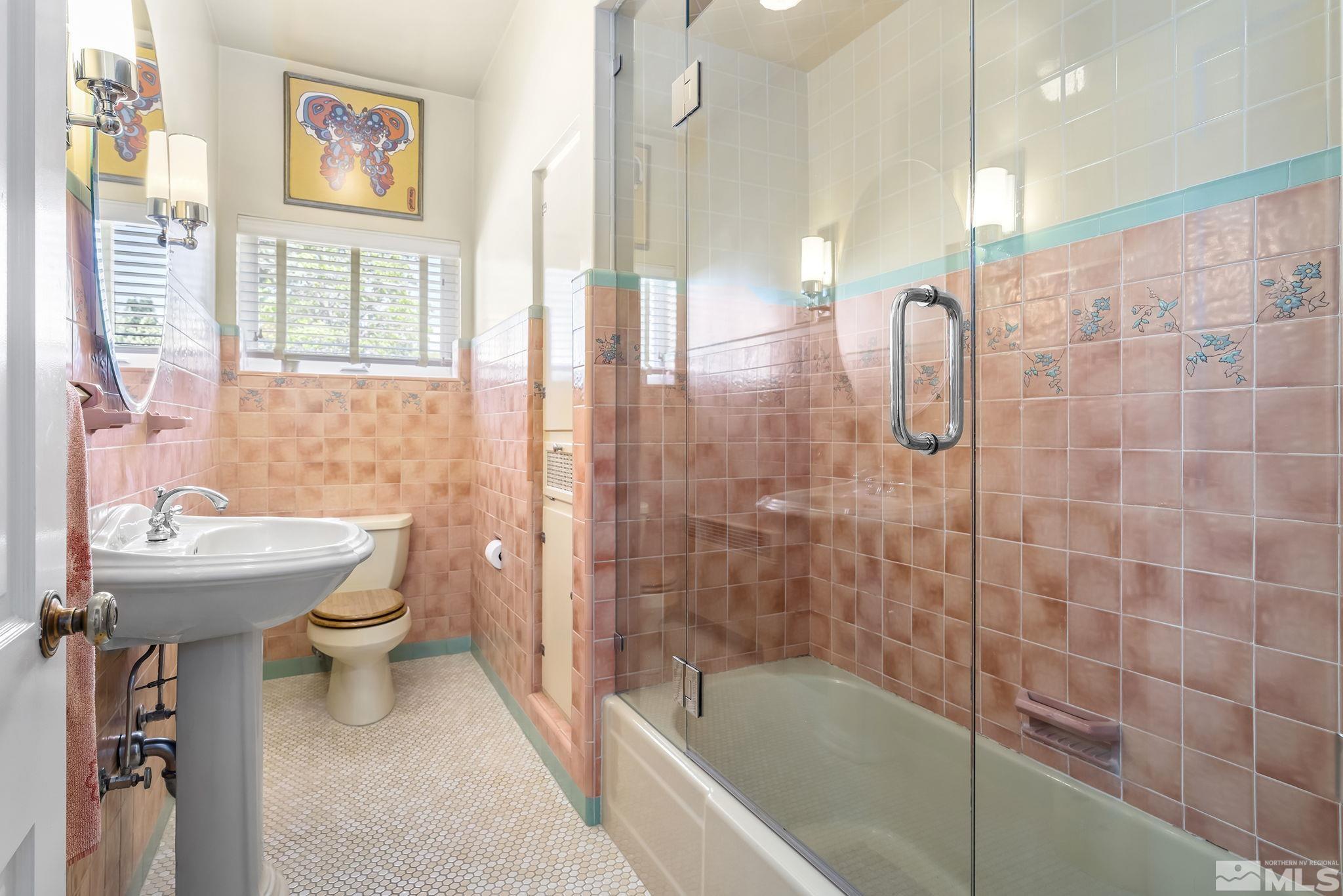 209 Urban Road Reno, NV 89509 - Photo 23 of 34 a bathroom with a sink a toilet and shower