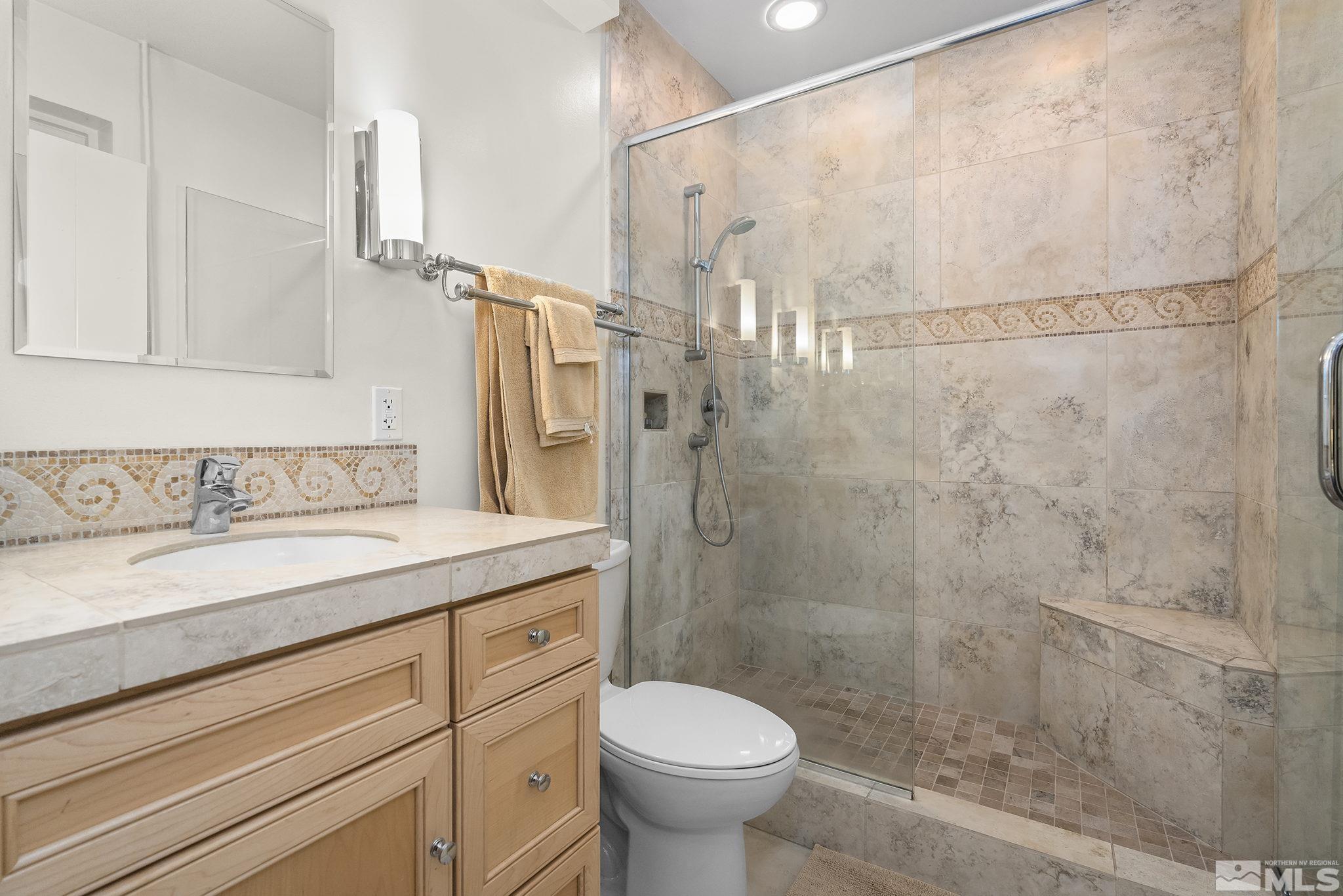 209 Urban Road Reno, NV 89509 - Photo 25 of 34 a bathroom with a granite countertop sink toilet and shower