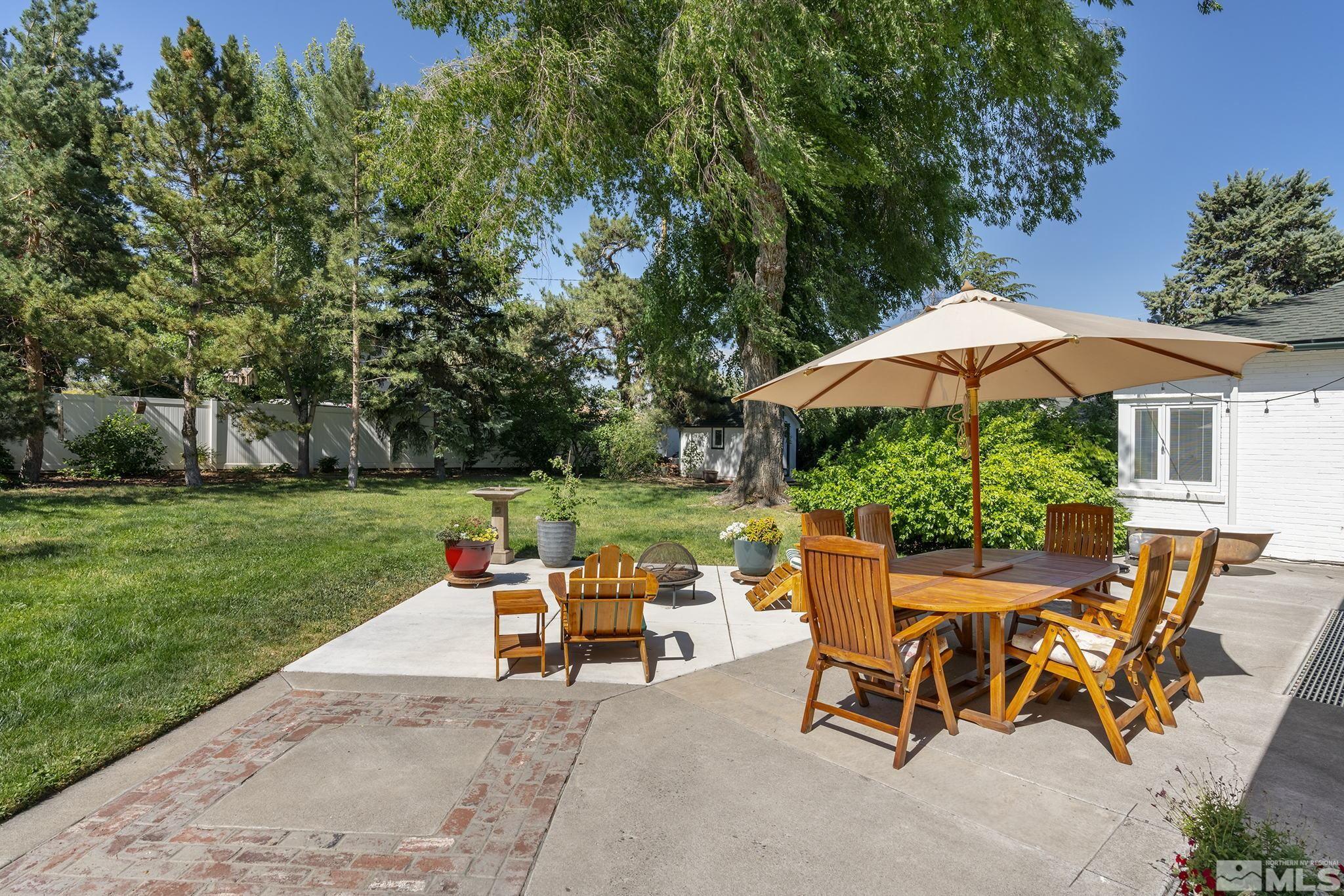 209 Urban Road Reno, NV 89509 - Photo 32 of 34 a chairs and table in backyard of the house