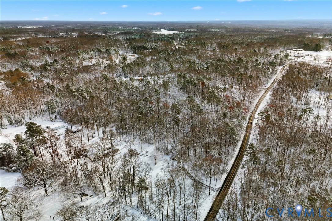 0 McClellan Road Mechanicsville, VA 23111 - Photo 11 of 14 Snowy aerial view with a wooded view