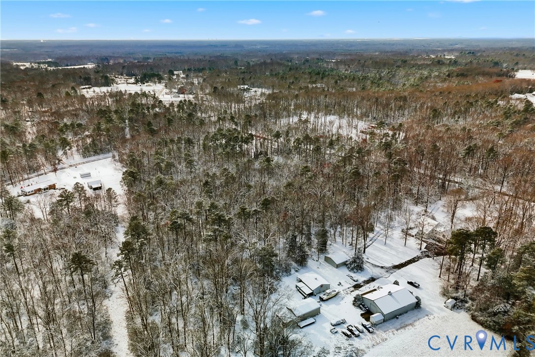 0 McClellan Road Mechanicsville, VA 23111 - Photo 9 of 14 Snowy aerial view featuring a wooded view