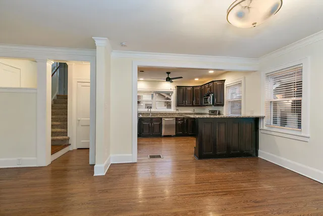 a view of kitchen with cabinets and wooden floor