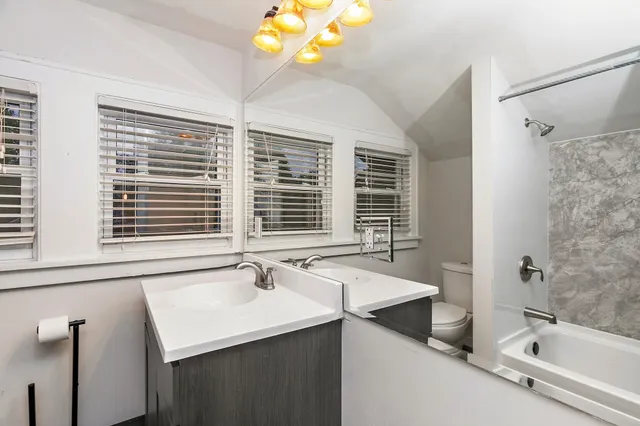 a bathroom with a sink and a bathtub