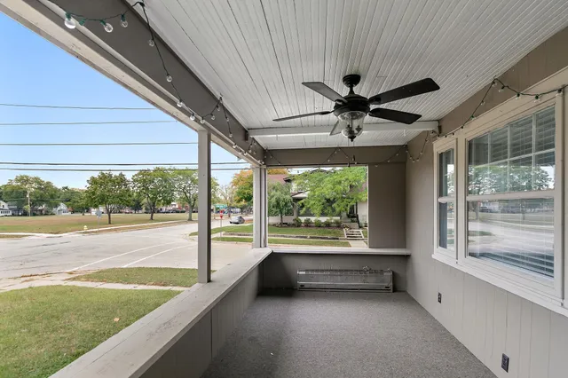 a view of a porch and garden