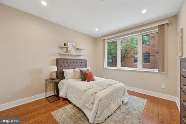 a bedroom with a large bed and a window