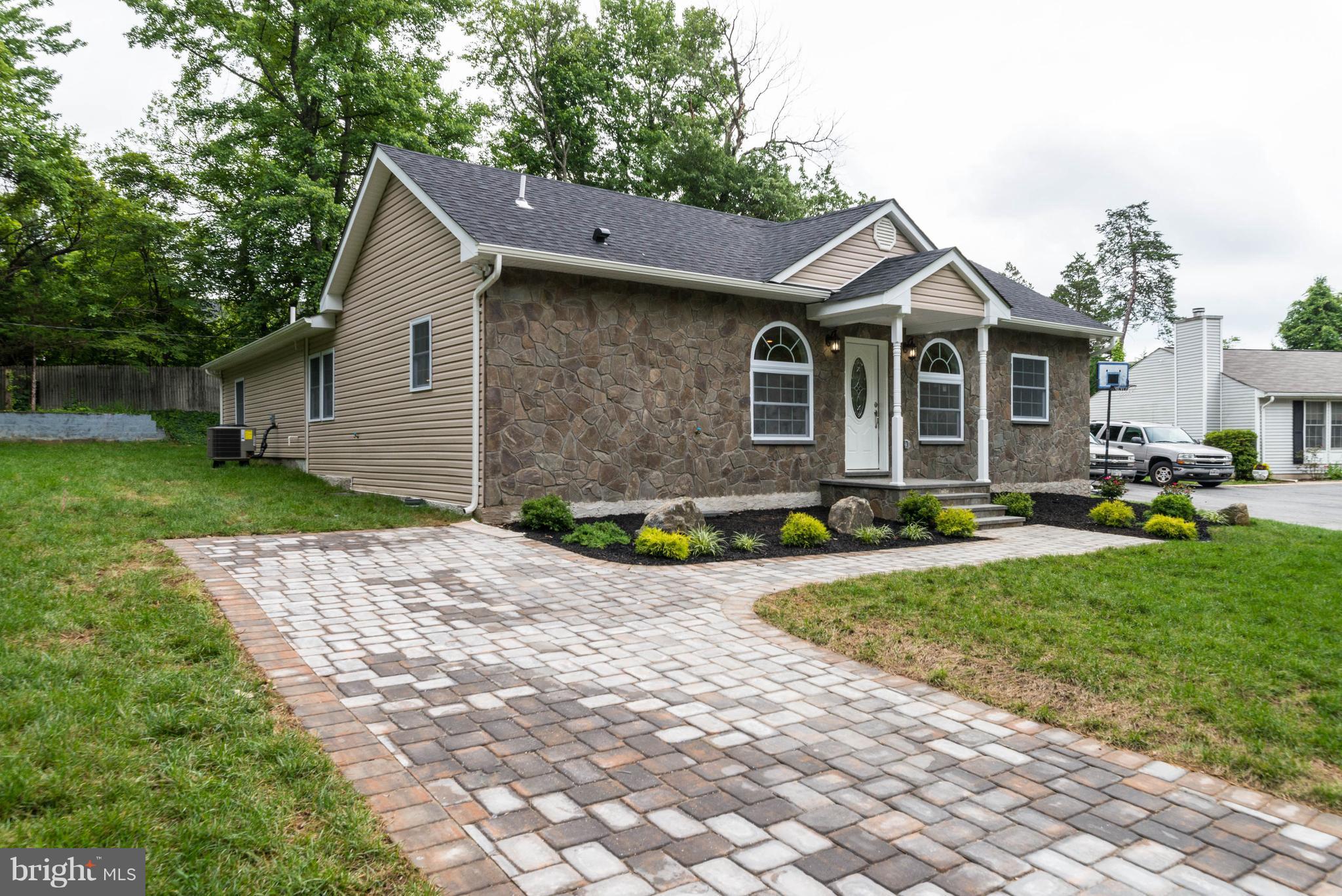 8220 Mission Road Jessup, MD 20794 - Photo 2 of 28 a front view of house with yard and green space