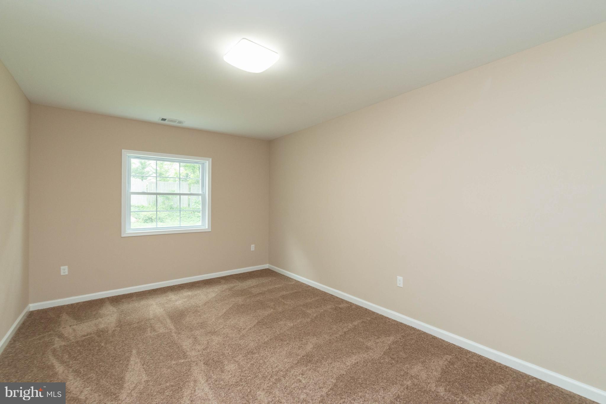8220 Mission Road Jessup, MD 20794 - Photo 13 of 28 an empty room with a window