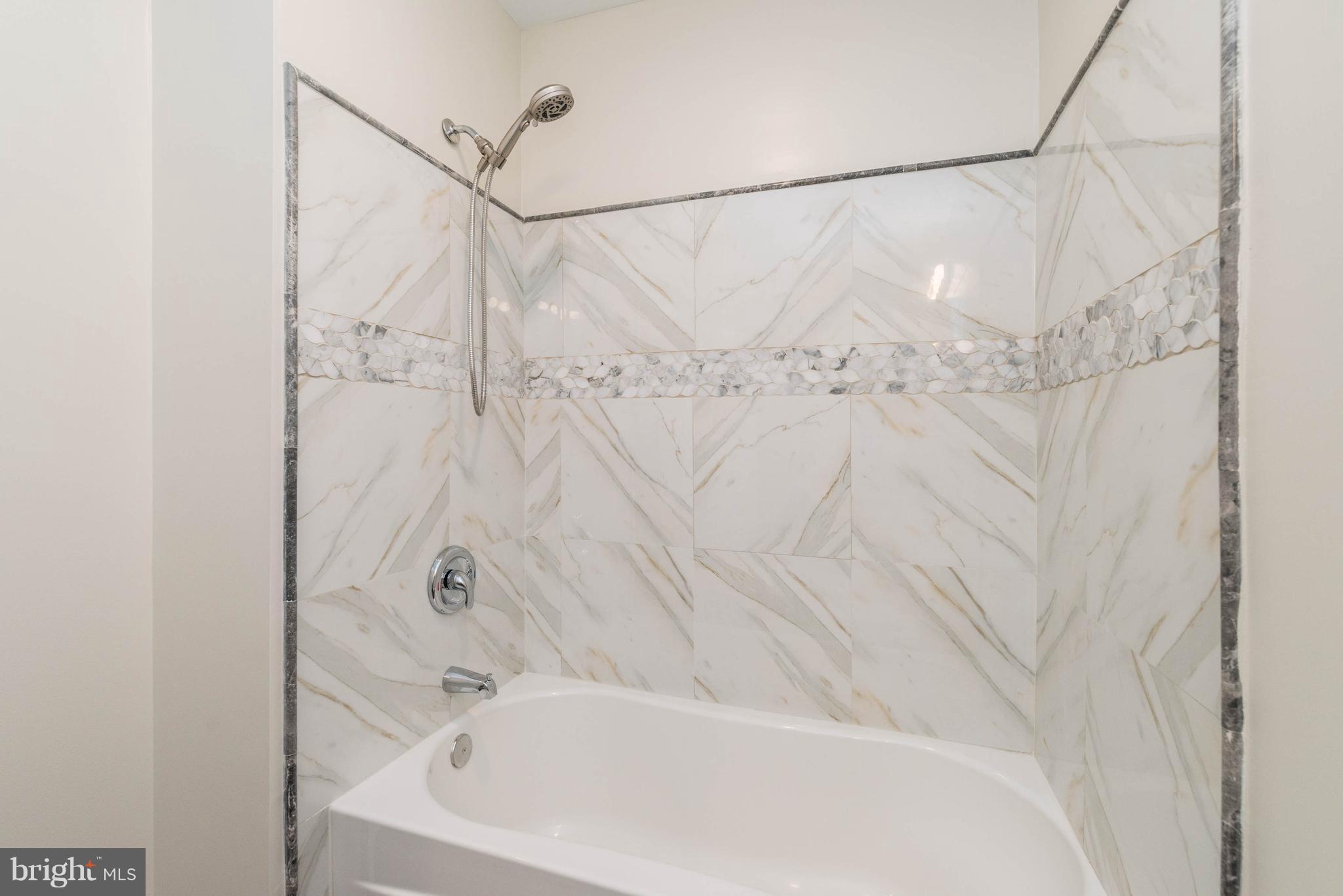 8220 Mission Road Jessup, MD 20794 - Photo 16 of 28 a close view of a bathtub in bathroom