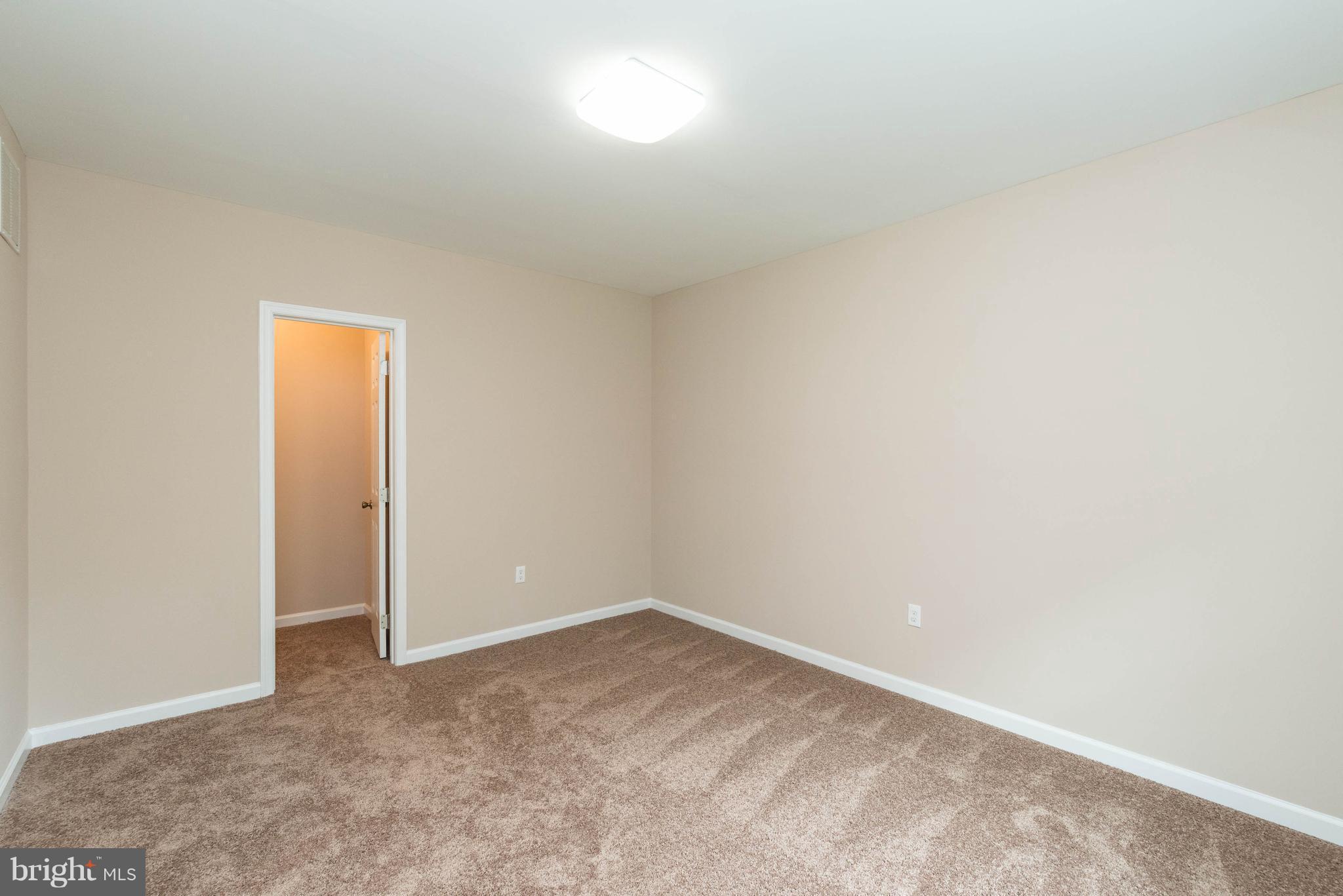 8220 Mission Road Jessup, MD 20794 - Photo 17 of 28 a view of an empty room and window