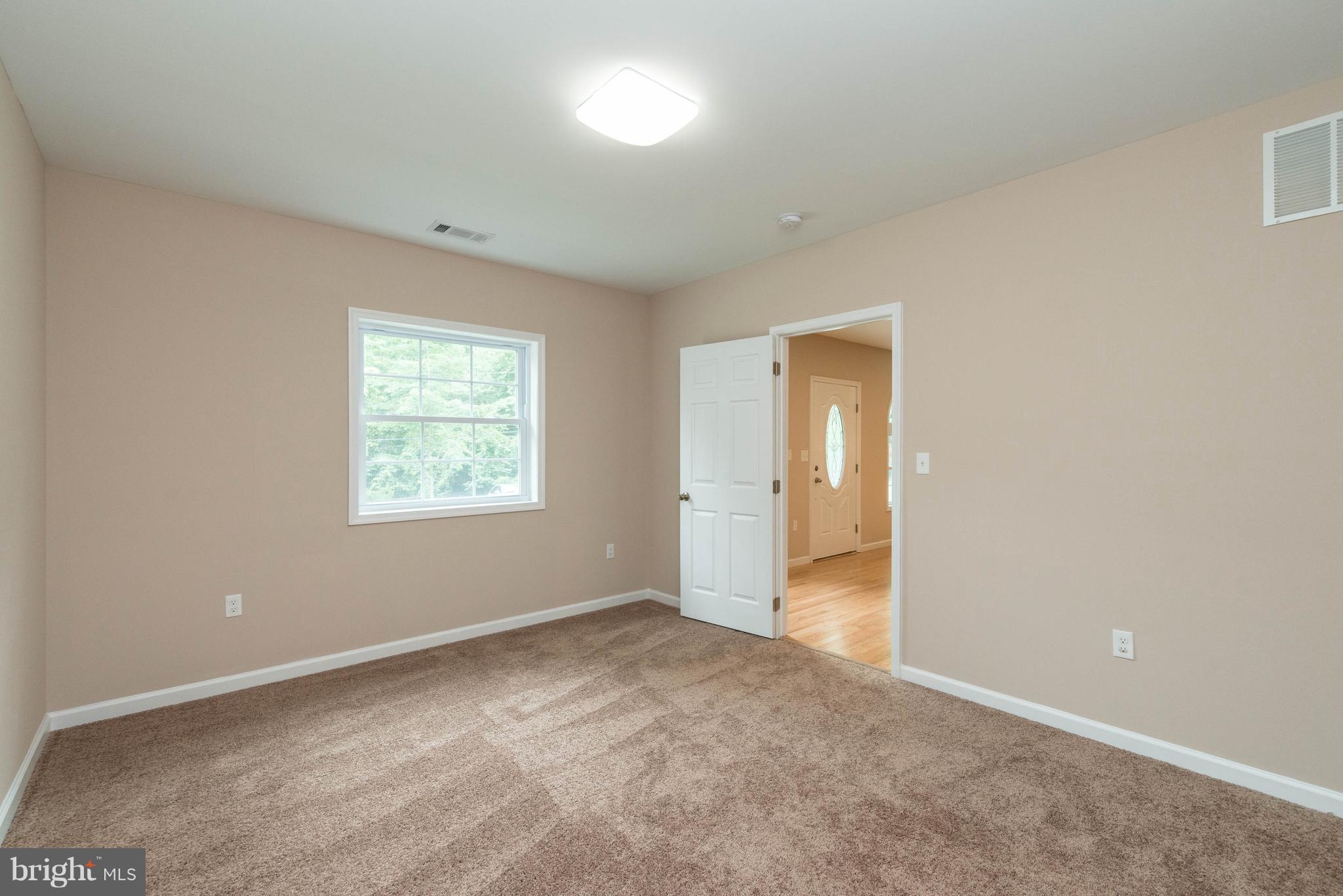 8220 Mission Road Jessup, MD 20794 - Photo 18 of 28 an empty room with a natural light