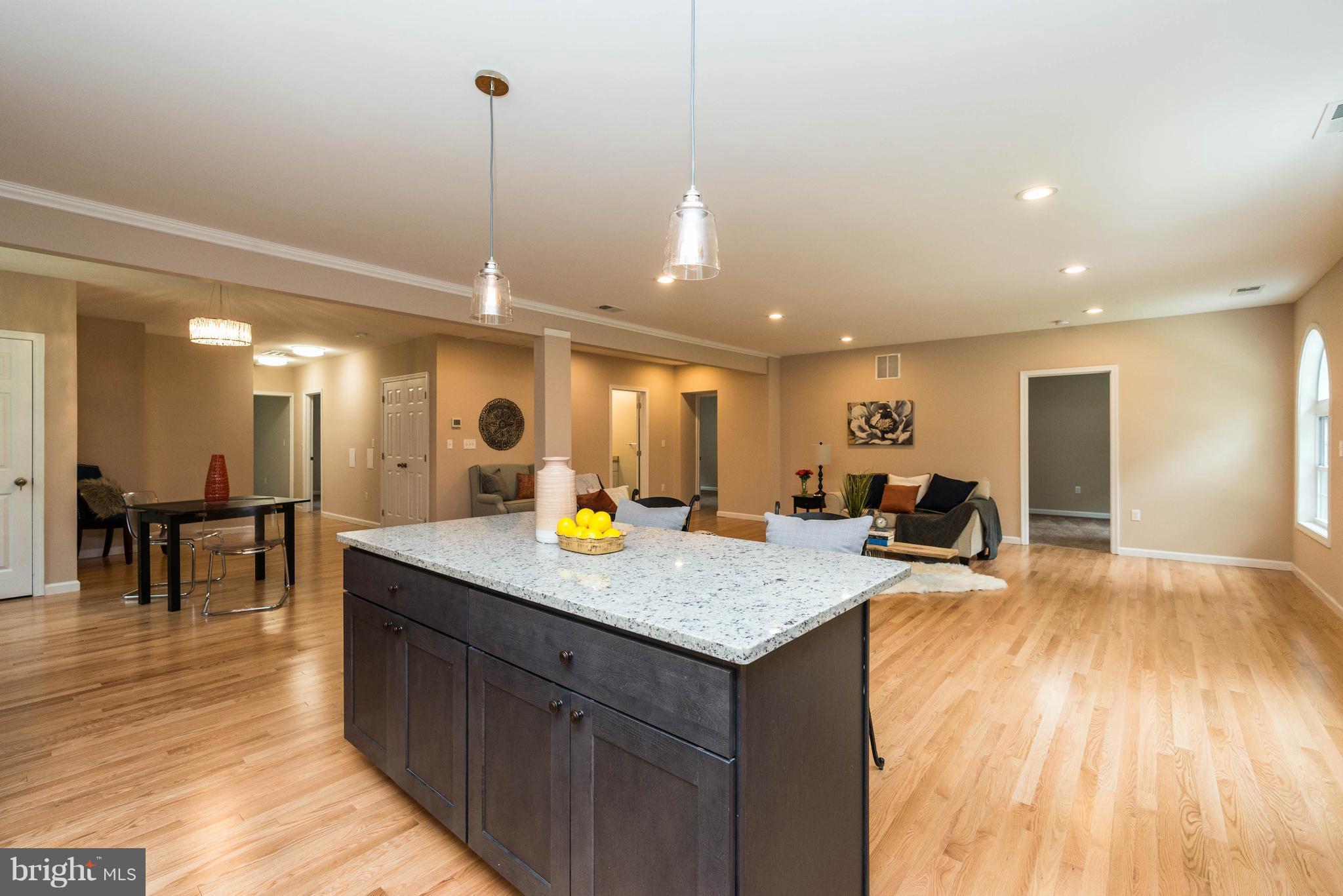 8220 Mission Road Jessup, MD 20794 - Photo 28 of 28 a kitchen with a sink a counter top space and stainless steel appliances