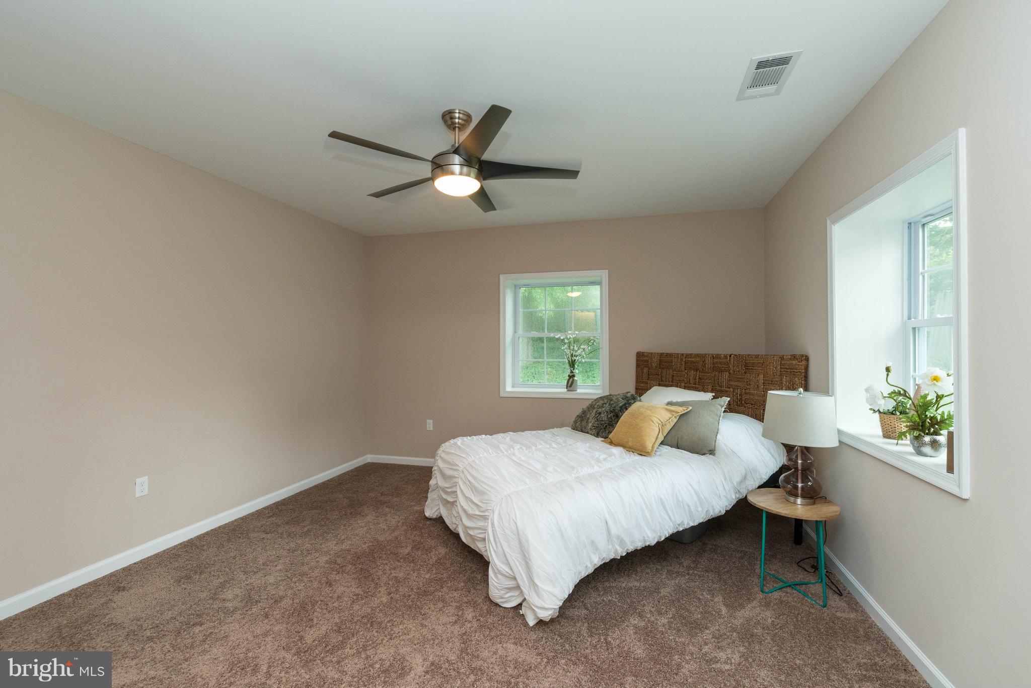 8220 Mission Road Jessup, MD 20794 - Photo 4 of 28 a bedroom with a bed and window