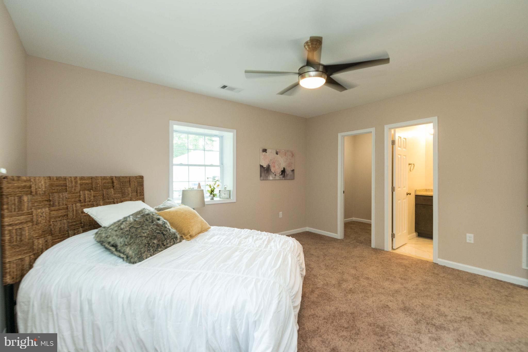 8220 Mission Road Jessup, MD 20794 - Photo 5 of 28 a bedroom with a bed and a window