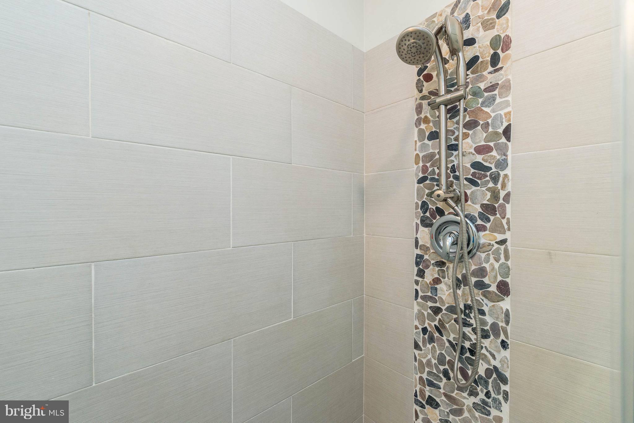 8220 Mission Road Jessup, MD 20794 - Photo 7 of 28 a bathroom with a shower curtain and a sink