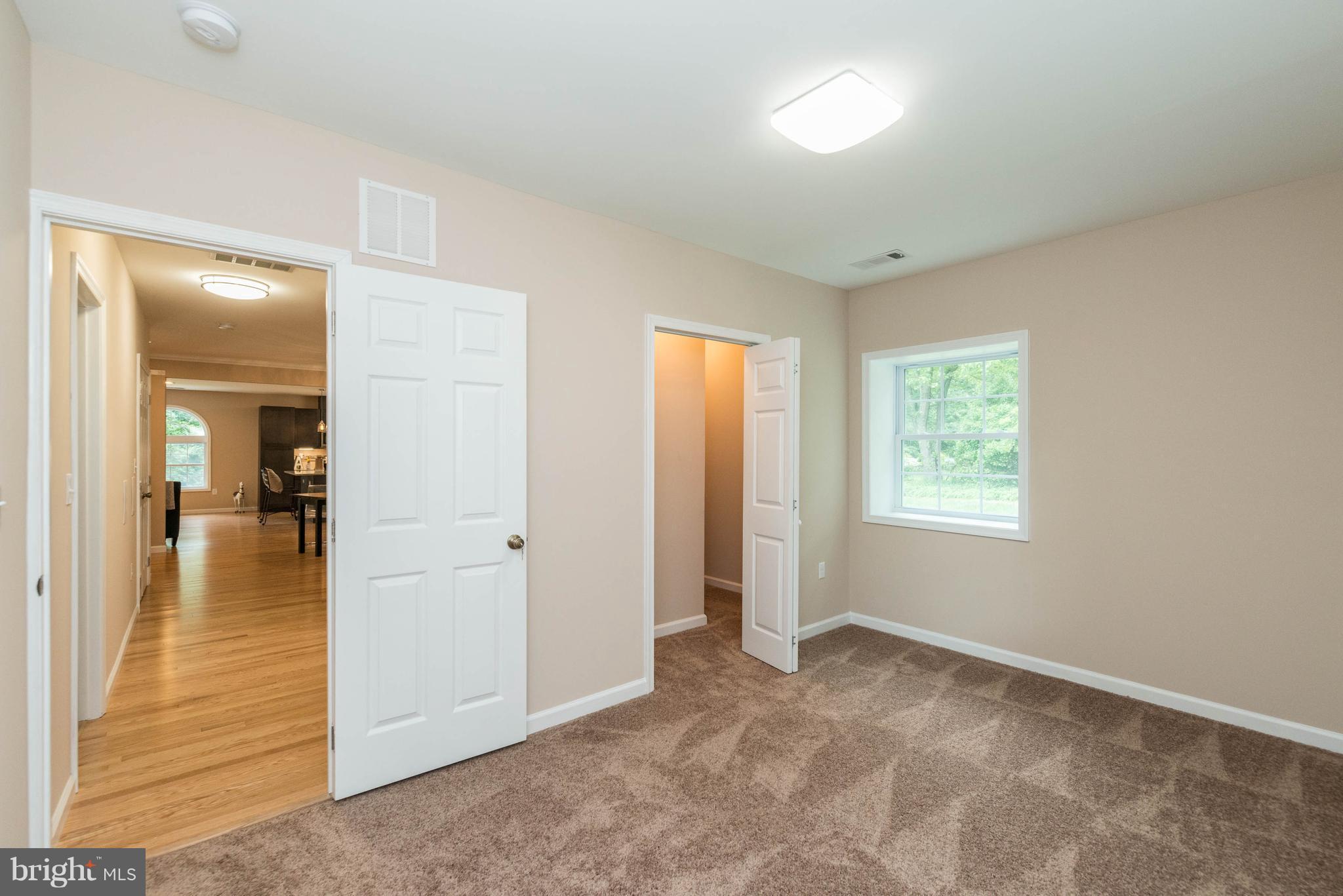 8220 Mission Road Jessup, MD 20794 - Photo 10 of 28 an empty room with windows and closet