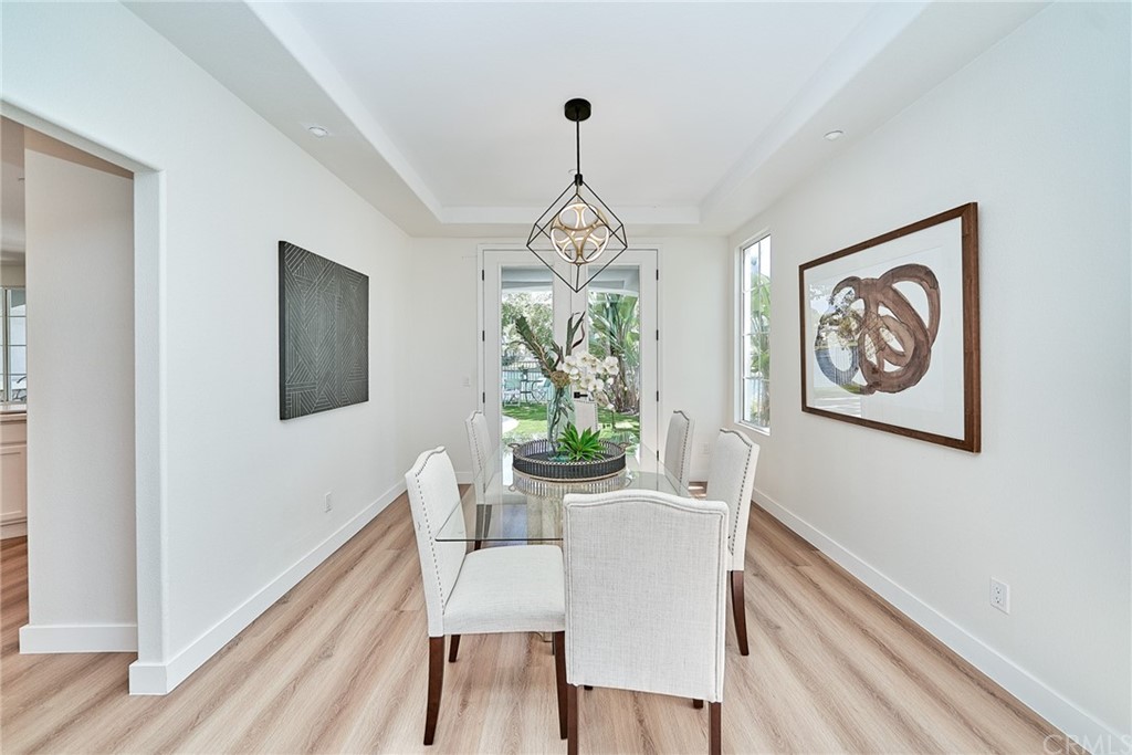 50 Lakeside Drive Buena Park, CA 90621 - Photo 27 of 69 a dining room with furniture a window and wooden floor