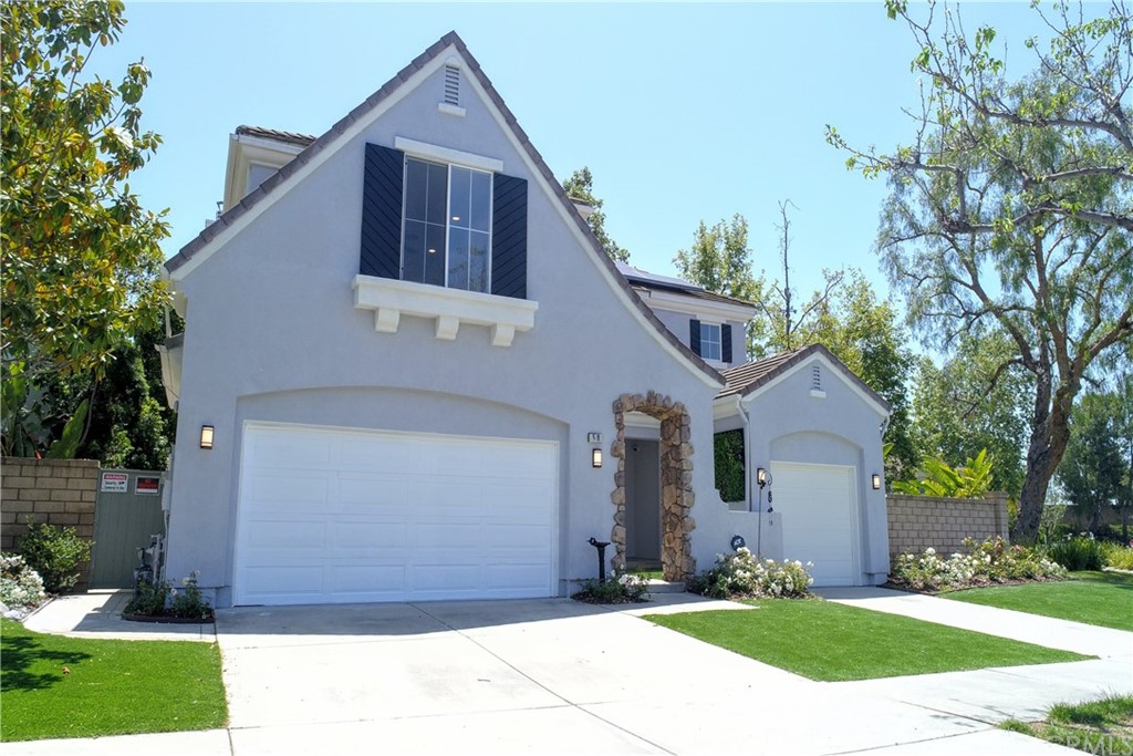 50 Lakeside Drive Buena Park, CA 90621 - Photo 3 of 69 a front view of a house with a yard and garage