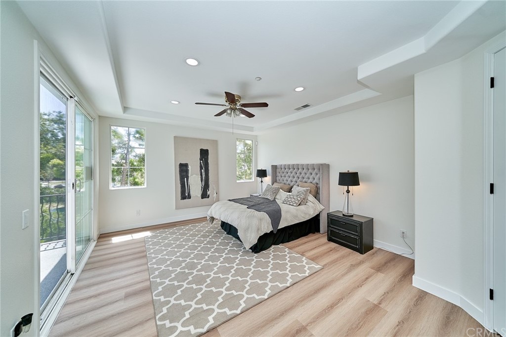 50 Lakeside Drive Buena Park, CA 90621 - Photo 43 of 69 a spacious bedroom with a large bed and a couch