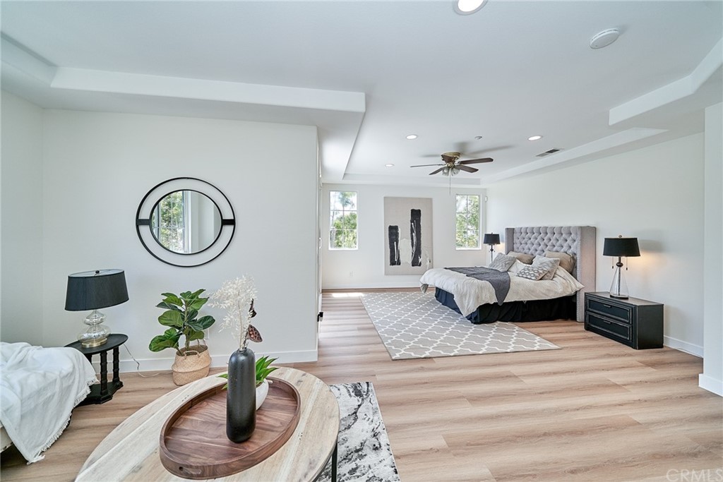 50 Lakeside Drive Buena Park, CA 90621 - Photo 45 of 69 a living room with furniture a mirror and a lamp