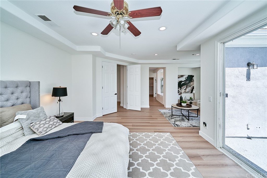 50 Lakeside Drive Buena Park, CA 90621 - Photo 46 of 69 a bedroom with furniture and a chandelier